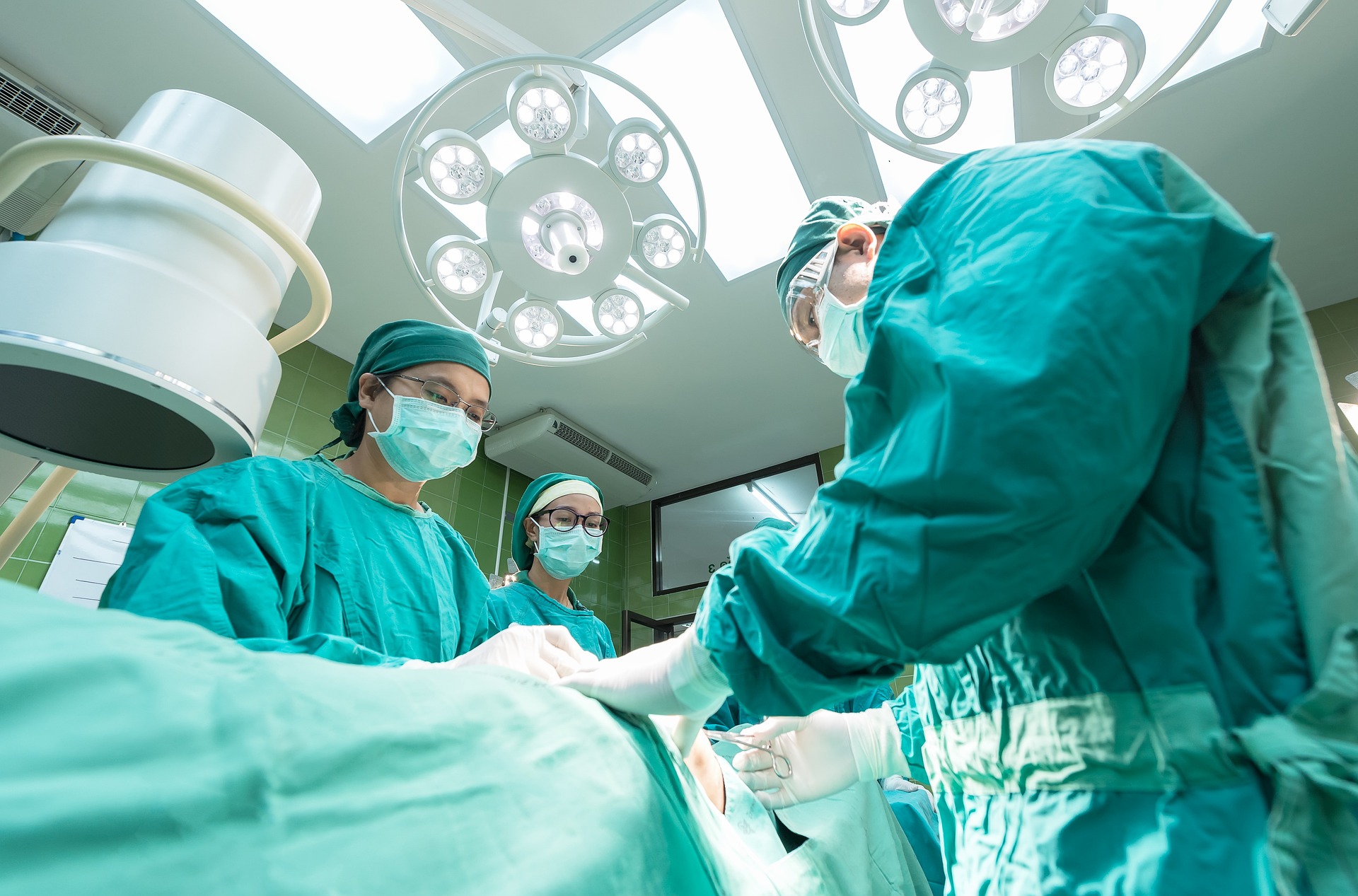 A surgical team operating in a hospital theatre in East Africa